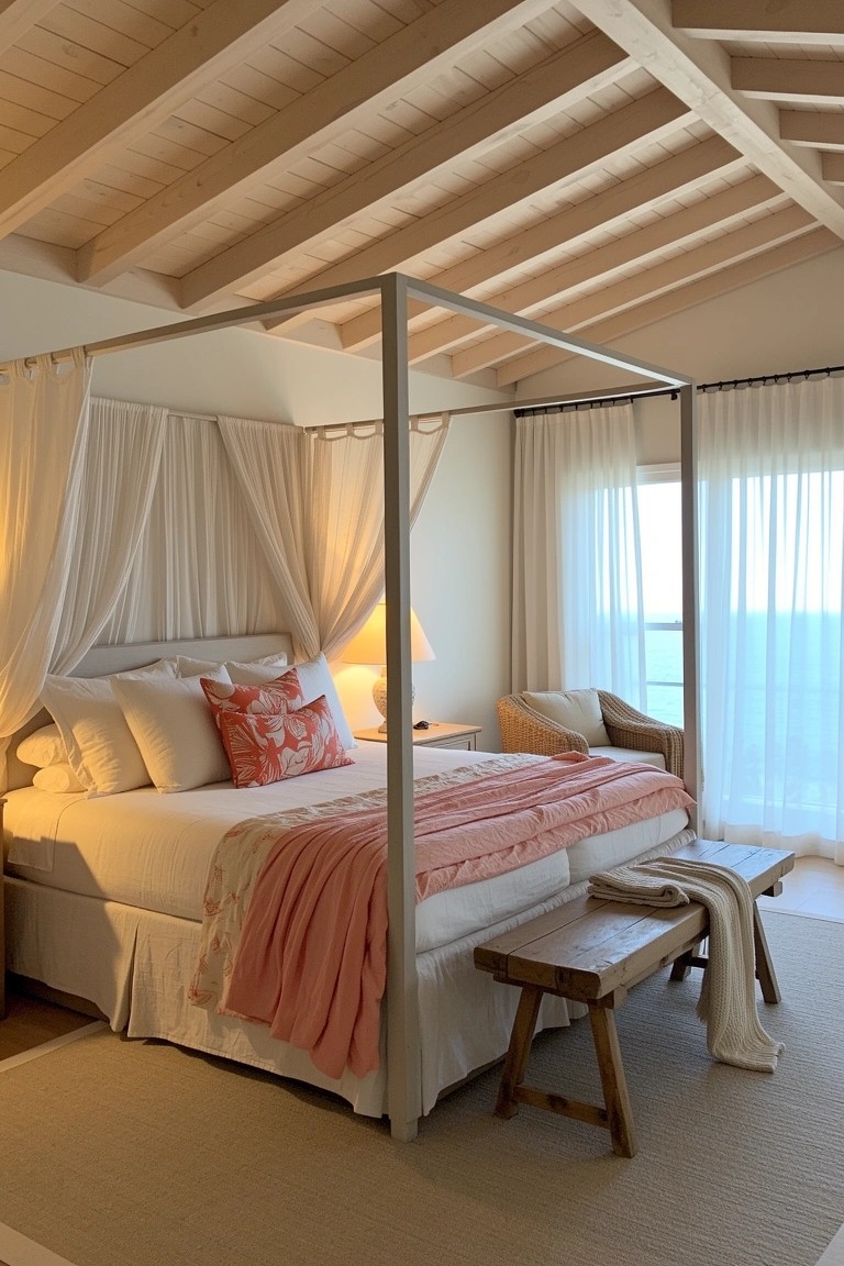 Beachy bedroom featuring a white four-poster bed with sheer canopy drapes, pink bedding, wooden ceiling beams, and large window overlooking water