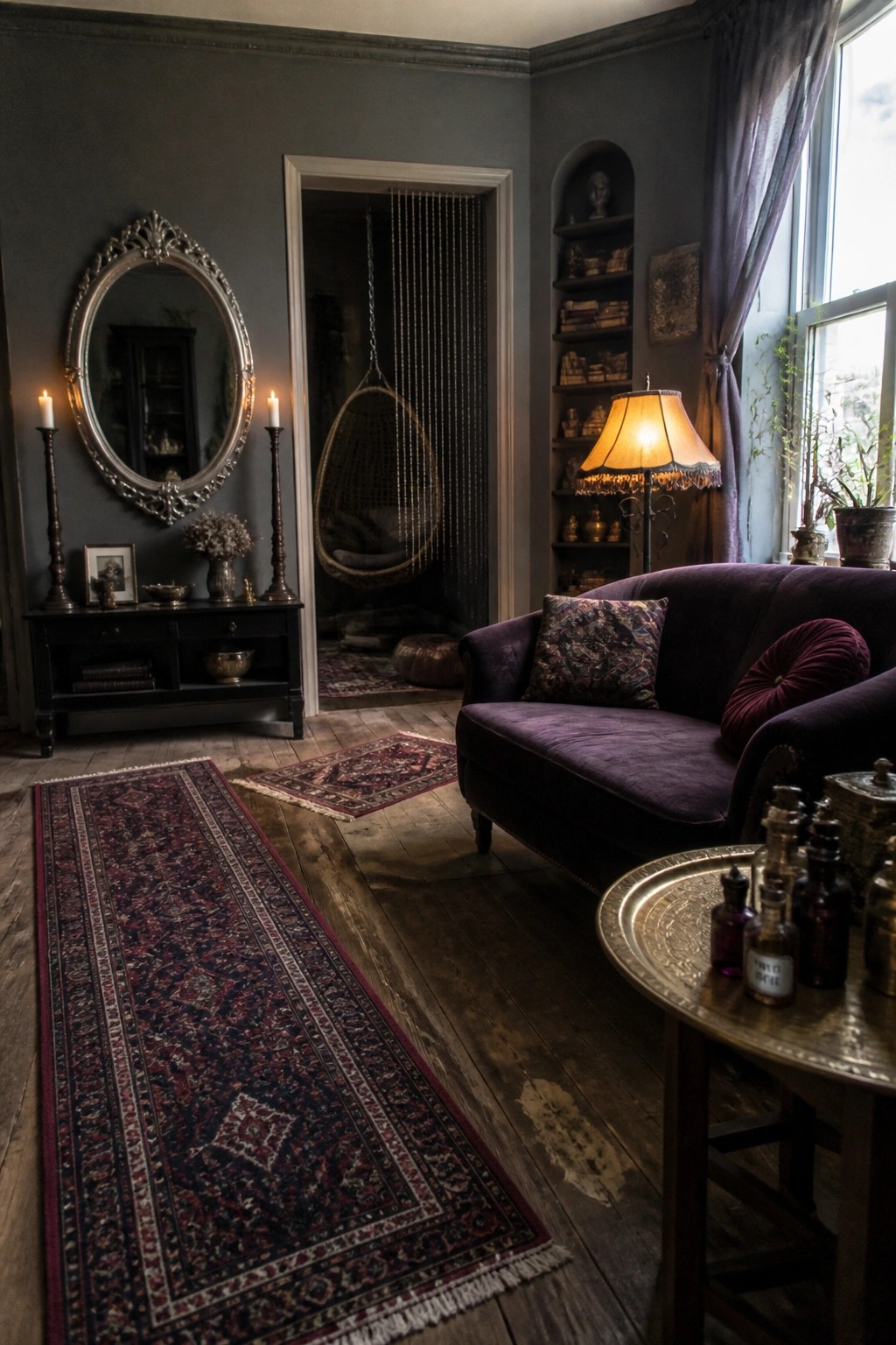 Dark gothic room with purple velvet sofa, ornate mirror, hanging chair, and rugs.